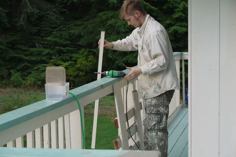 Chris installing the slats on the railings, first from above.