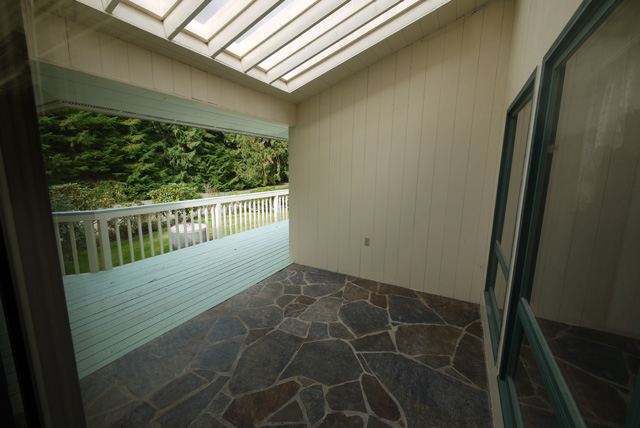 The atrium and deck between the main part of the house and the master bedroom.