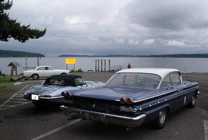 Above The 65E dwarfed by Mike Howard Becker's 1960 Pontiac Star Chief