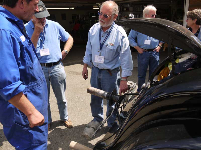 Above: Steve Norman getting his spare tire rack fixed.