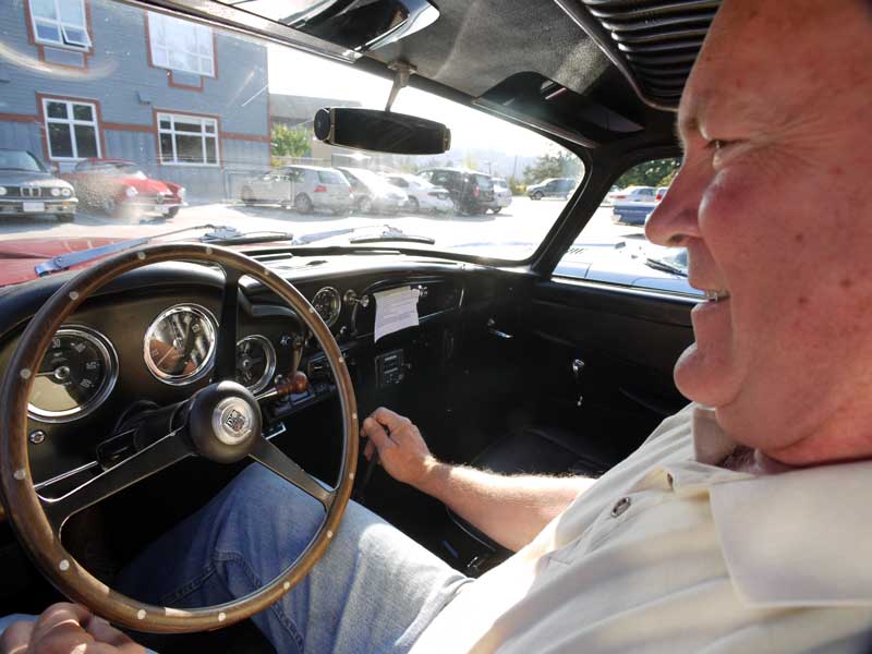 Duane Crandall warms up the old Aston.