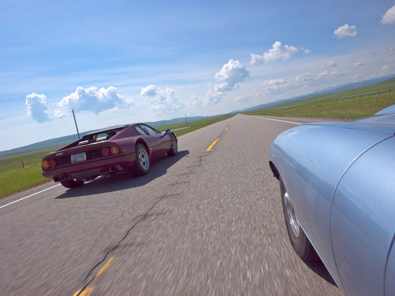 Jim Speer & Peter Bouchier blow by us at speed in a Ferrari 512 BB.