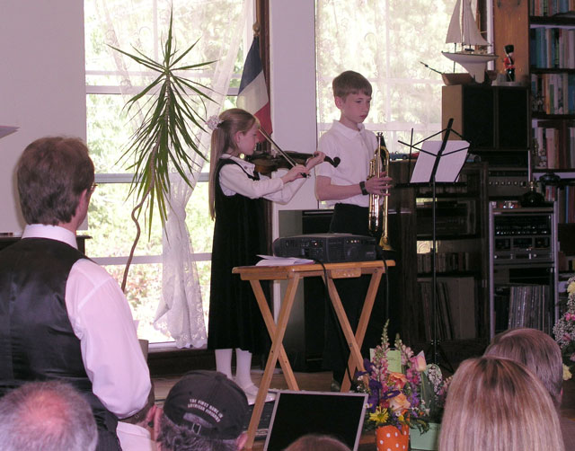 Amelia Breithaupt plays the violin, while her brother Bentley waits to accompany her on trumpet.
